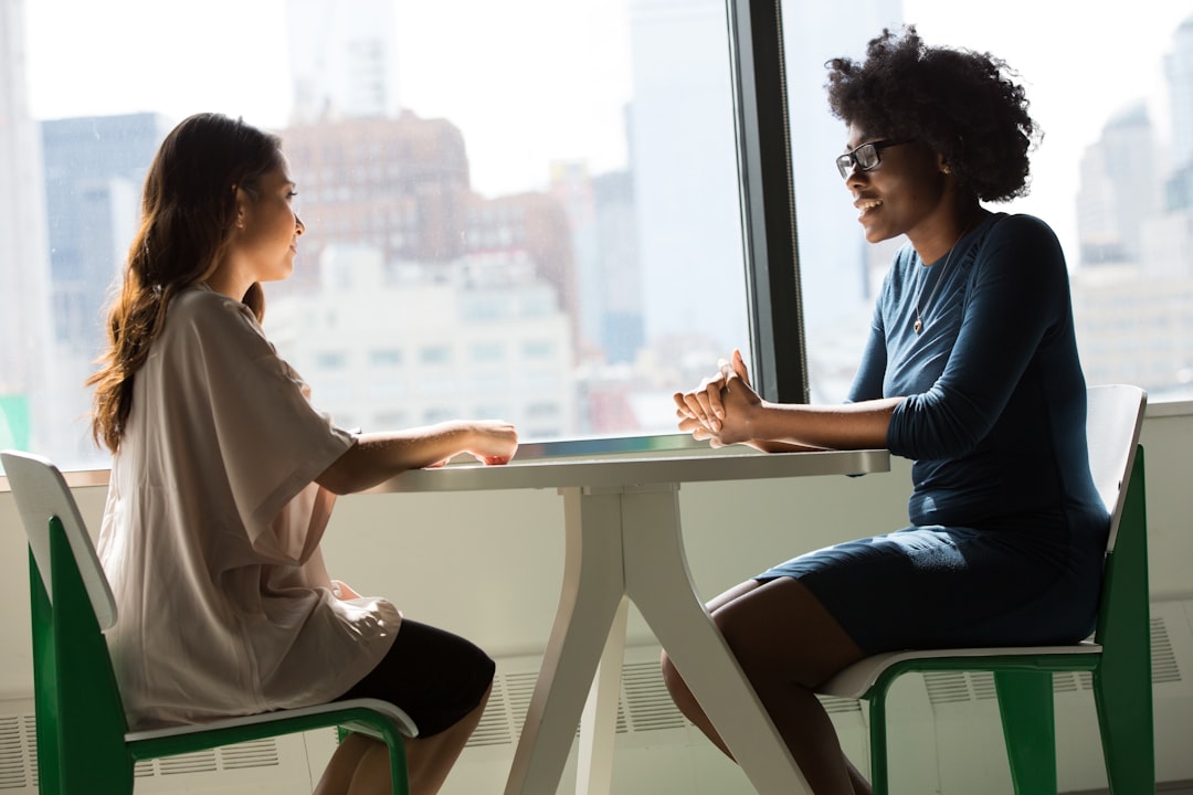 featured-images-04 two-women-sitting-beside-table-and-talking-lq1t-8ms5py